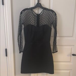 Elegant Black Dress with Sheer Polka Dot Sleeves